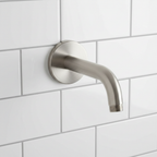 Grohe wall mount shower arm with escutcheon brushed nickel close-up showing finish texture and round escutcheon plate against white tile