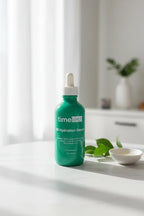 Fresh healthy skin routine showing a green glass skincare serum bottle in natural window lighting on a simple minimalist white marble surface