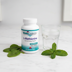 NutriCology L-Methionine bottle on marble with green leaves and glass of water – More4less Outlet