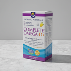 AI-generated contextual image of Nordic Naturals Complete Omega-D3 package at a three-quarter angle on a neutral surface