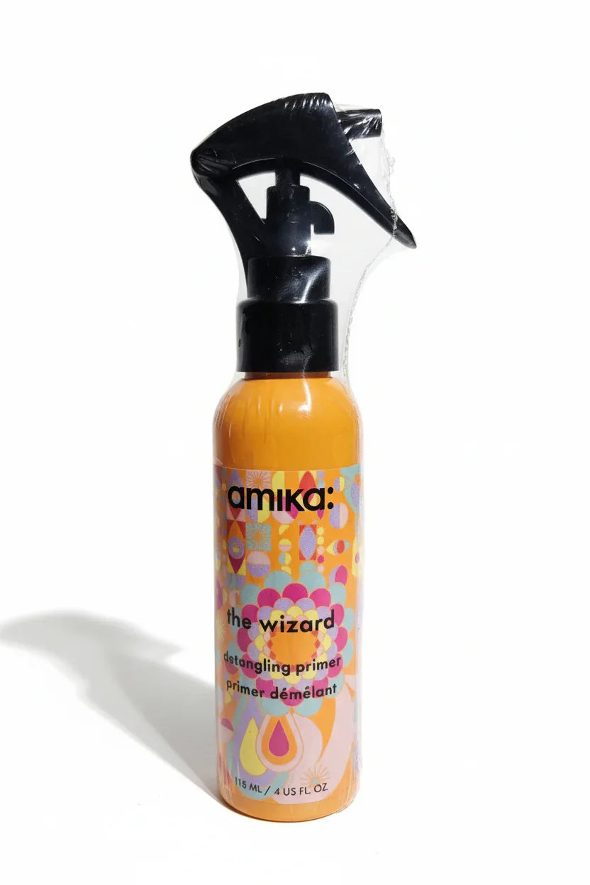 amika The Wizard detangling primer close-up hero shot orange colorful bottle