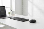Logitech MK470 Slim Wireless Combo on minimalist modern desk with laptop and pebble mouse – More4less Outlet