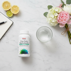 GNC Women's One Daily Multivitamin 50 Plus bottle on marble with flowers and water – More4less Outlet
