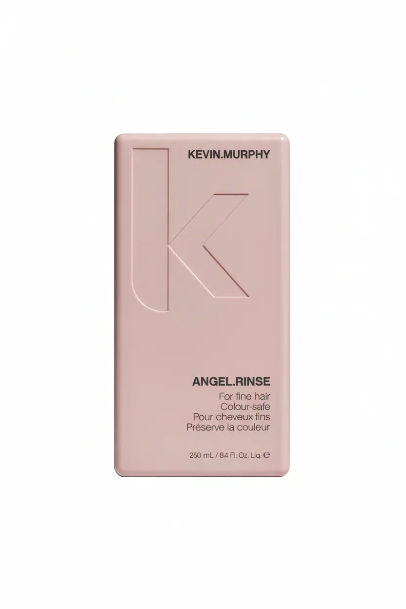 KEVIN.MURPHY ANGEL.RINSE close-up hero shot showing embossed K logo on blush pink bottle