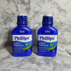 Bright lighting arrangement of two reliable blue digestive comfort solution bottles for daily health needs on white marble