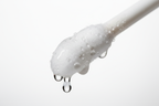 Macro shot of cotton pad soaked in ZO Medical Balatone pH balancing toner
