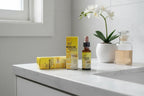 Bach Rescue Remedy 10ml Dropper on white bathroom vanity with orchid — natural wellness daily routine