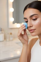 Woman applying loose setting powder with Olivia Rose blue mini powder puff under eye — More4less Outlet