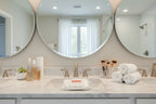 Clean master bathroom lifestyle scene displaying beauty routine essentials with makeup remover wipes on marble countertop