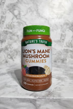 Nature's Truth Lion's Mane Gummies jar with natural sunlight on marble countertop