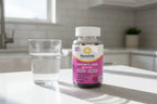 RenewLife Women's Care gummy bottle on bright kitchen counter morning natural light glass of water