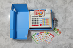 Hape Beep n Buy Cash Register gift flatlay on white marble with blue retail box play money and scanner - More4less Outlet