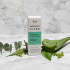 Rael Beauty Miracle Clear Acne Serum white and green box beside fresh aloe vera and green botanicals on white marble – More4less Outlet