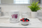 Thorne Ovarian Care on marble bathroom counter with berries women's wellness lifestyle