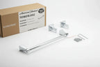 Studio product layout showcasing chrome bathroom towel bar fixture and mounting hardware kit