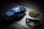Flat lay of Gelbee Flurry Glove blaster with gel BBs and safety goggles on dark tactical surface — More4less Outlet