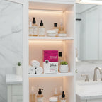 Viviscal Advanced Hair Health box in white wood bathroom cabinet with boutique glass skincare and health items