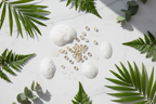 Panthenol vitamin B5 capsules surfactant bubbles polysorbate droplets and botanical leaves flat lay curl shampoo ingredients lifestyle photo