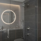 American Standard Studio S chrome shower valve trim in a luxury spa bathroom with dark grey tile and frameless glass enclosure.