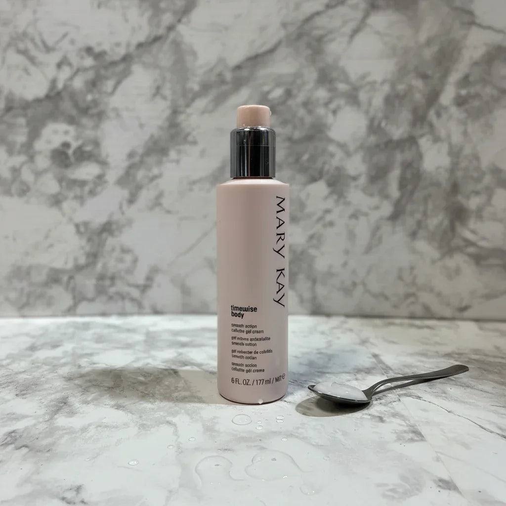 Professional studio shot of Mary Kay TimeWise Body beauty cream pump bottle on clean light marble background