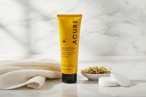 ACURE Seriously Soothing Cleansing Cream on marble vanity with chamomile flowers lifestyle