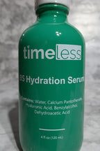 High-quality macro photo focusing on clean white label text on a dark green glass professional beauty serum bottle