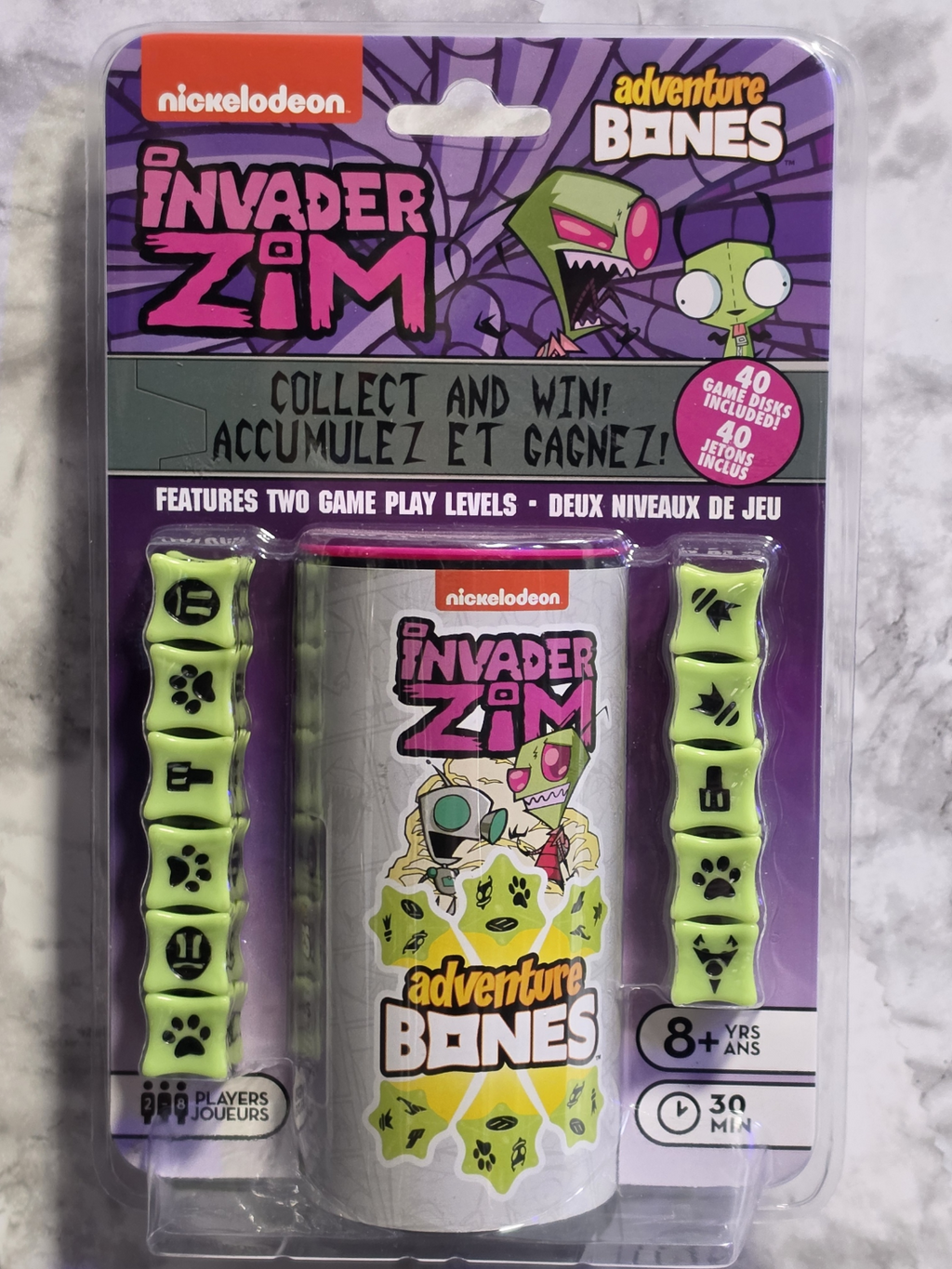 Packaged toy set with 'Invader Zim' branding on a marble surface