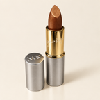 Mary Kay Signature Creme Lipstick Gold Dust in silver and gold tube on ivory background