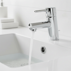 Close-up of Grohe Concetto chrome faucet with water flowing into a white ceramic sink.