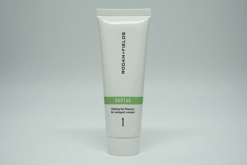 Studio lighting detail shot of Rodan + Fields SOOTHE travel cleanser tube with green accent band