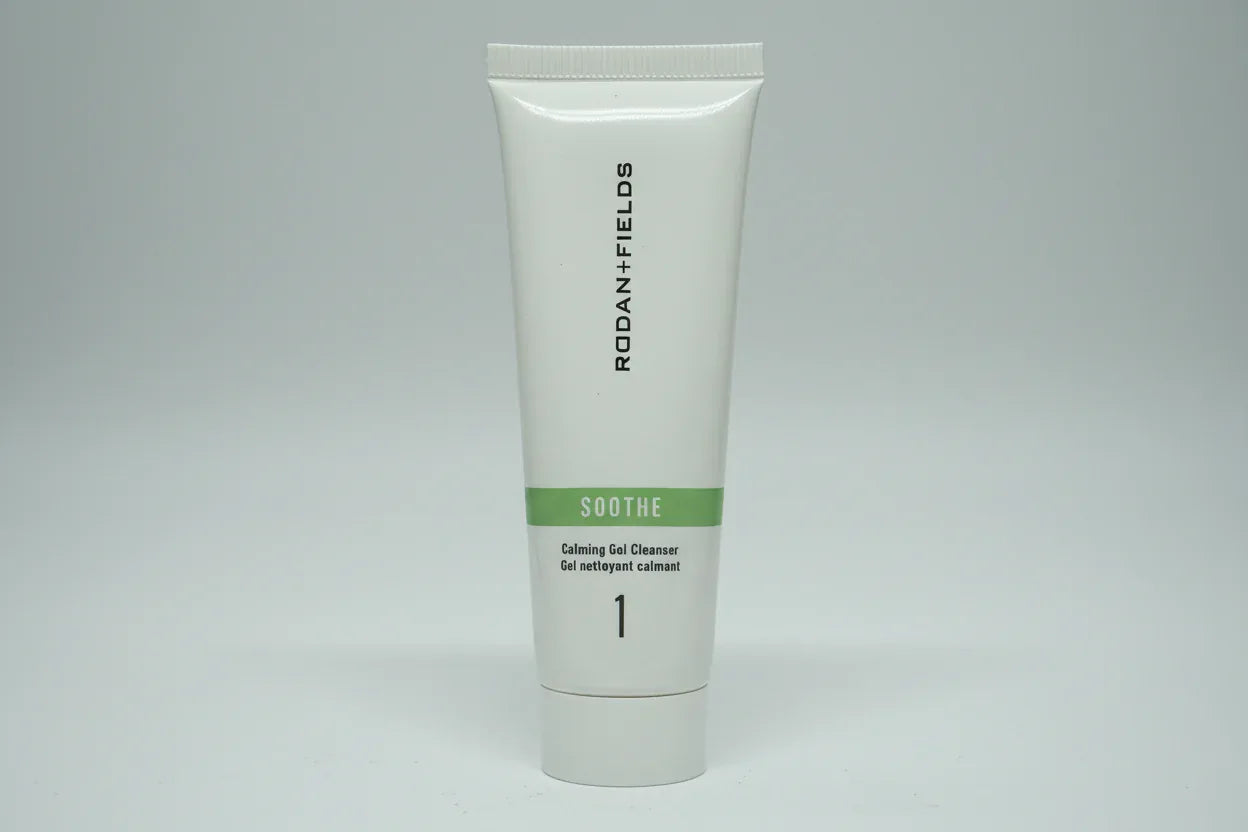 Studio lighting detail shot of Rodan + Fields SOOTHE travel cleanser tube with green accent band
