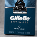 Close up of the Gillette Intimate razor box front panel showing the razor head and branding