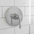 American Standard Studio S polished chrome pressure balance valve trim installed on a white subway tile shower wall.
