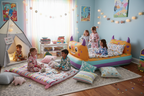 Tidy children's bedroom set up for overnight sleepover party with inflatable air mattress