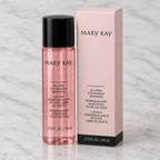 Mary Kay Oil-Free Eye Makeup Remover bottle and retail box on a pale stone surface