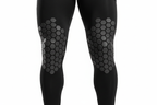 Close-up of McDavid HEX compression leg sleeves showing graduated hexagonal knee padding detail — full-length black athletic leg sleeves size medium