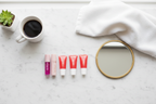 Manna Kadar lip care set minimalist morning skincare routine flat lay marble — More4less Outlet
