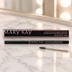 Mary Kay Precision Brow Liner pencil and retail box on a light vanity with a spoolie