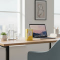 Winged Rise Up gummies yellow box on home office desk with morning light lifestyle image