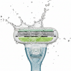 Macro shot of fresh water splashing against high-precision razor blades