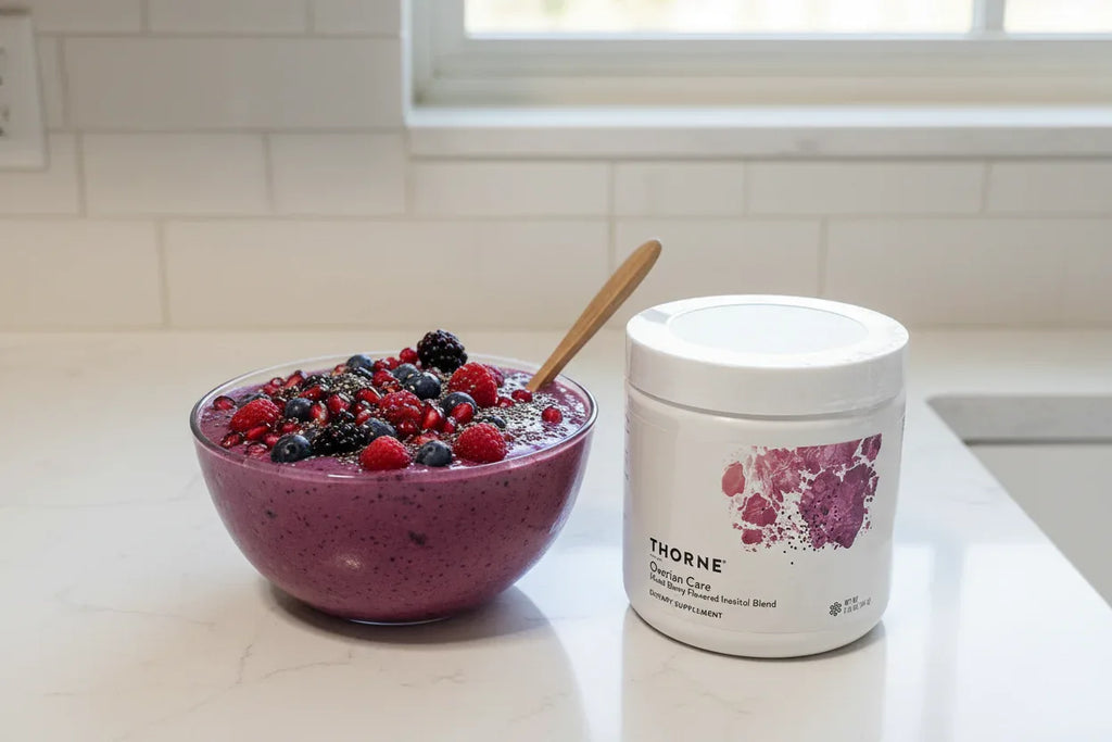 Thorne Ovarian Care on kitchen counter with mixed berry smoothie bowl lifestyle