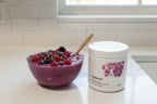 Thorne Ovarian Care on kitchen counter with mixed berry smoothie bowl lifestyle