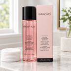 Mary Kay Oil-Free Eye Makeup Remover bottle and retail box beside white cotton pads on a vanity