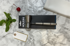 Houdini Double Jigger gift flatlay on white marble with cocktail napkin mint sprig and cherry - More4less Outlet