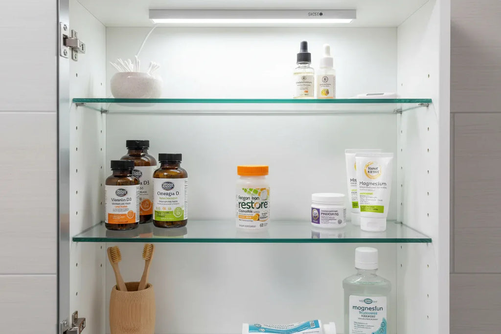 Bright medicine cabinet organized with wellness supplies featuring Fergon Iron Restore bottle