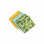 SuperBee Wax Wraps small triple pack three wraps fanned out showing yellow floral green plaid and green leaf patterns on white background