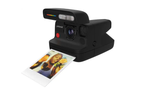 Black Polaroid instant camera with a printed photo on a white background