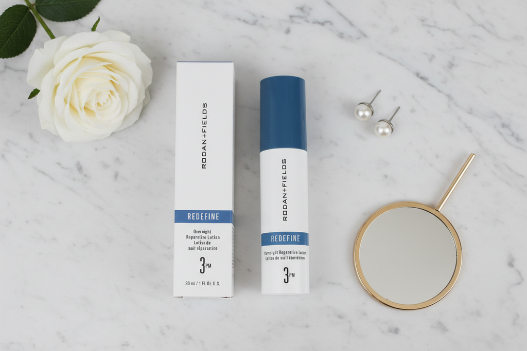 Rodan + Fields REDEFINE Overnight Reparative Lotion 3PM luxury flat lay with white rose pearl earrings and mirror on marble – More4less Outlet