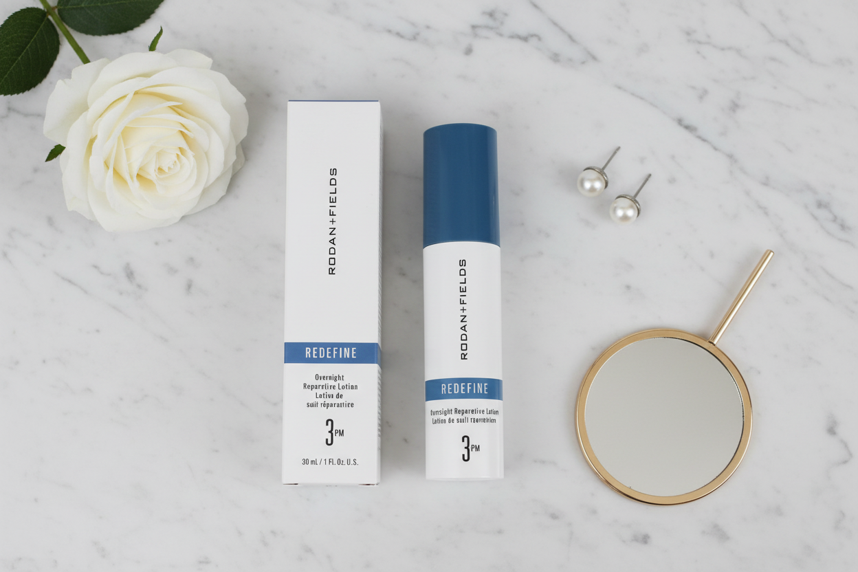 Rodan + Fields REDEFINE Overnight Reparative Lotion 3PM luxury flat lay with white rose pearl earrings and mirror on marble – More4less Outlet