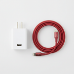 Flat lay of white USB-C wall charger and cranberry braided Lightning cable bundle on white surface — More4less Outlet